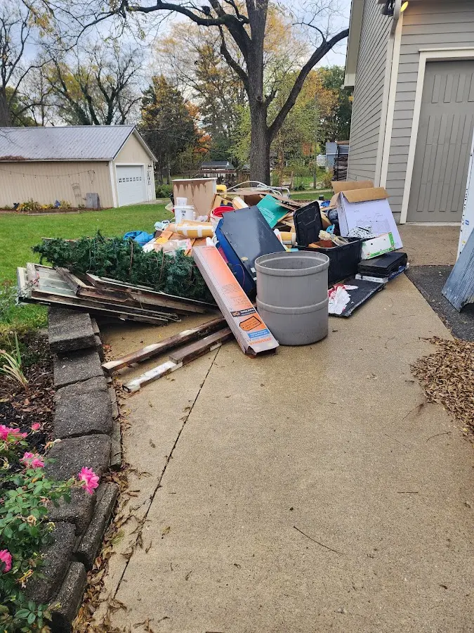 Dumpster being loaded with debris for Demolition Dumpster Rental in Pleasantville